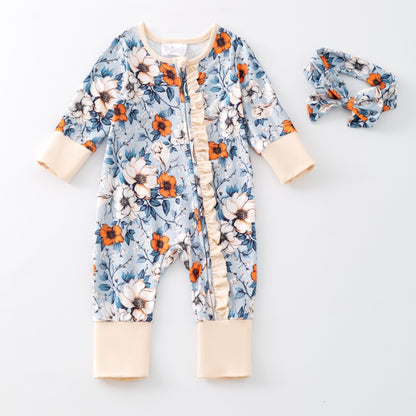 Floral baby onesie and headband on a white background