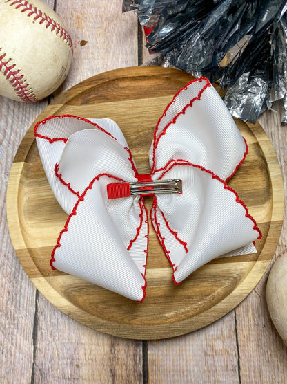 red and white baseball embroidered headband on a wooden background