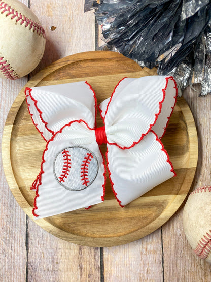red and white baseball embroidered headband on a wooden background