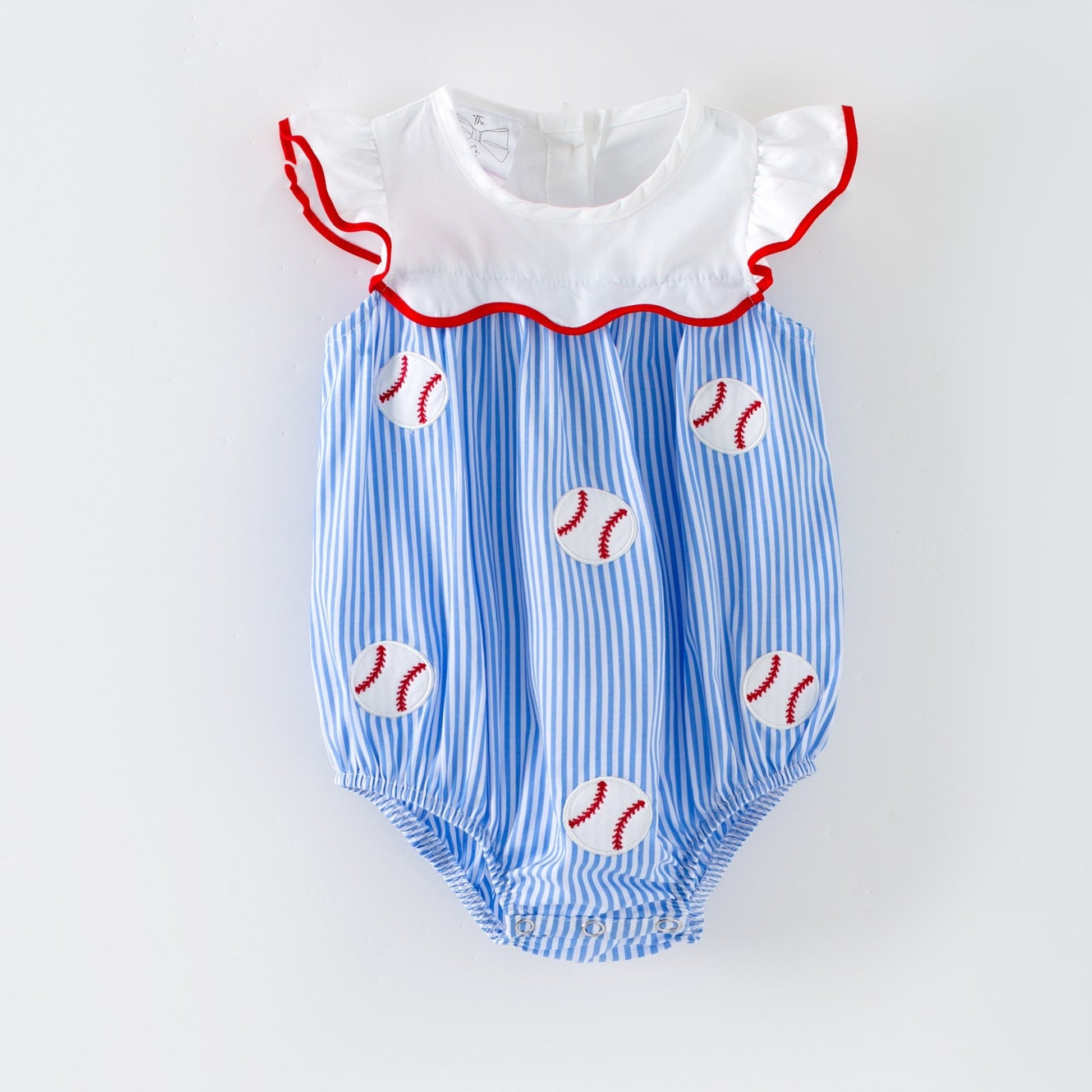 Baby romper with blue and white striped pattern and red baseball designs on a light gray background