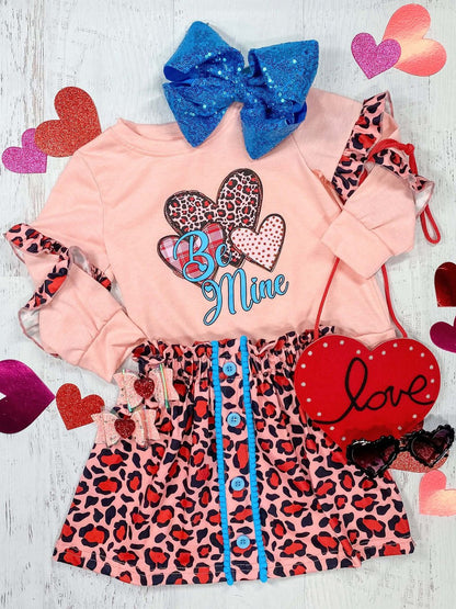 Animal print skirt set with pink long sleeve shirt with Be Mine design with a coordinating skirt with a pop of blue trim
