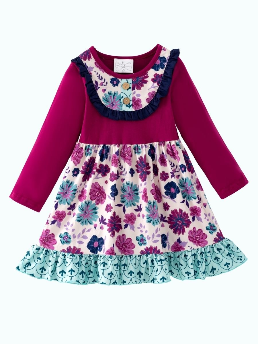 Floral twirl dress with a plum top and ruffle hem