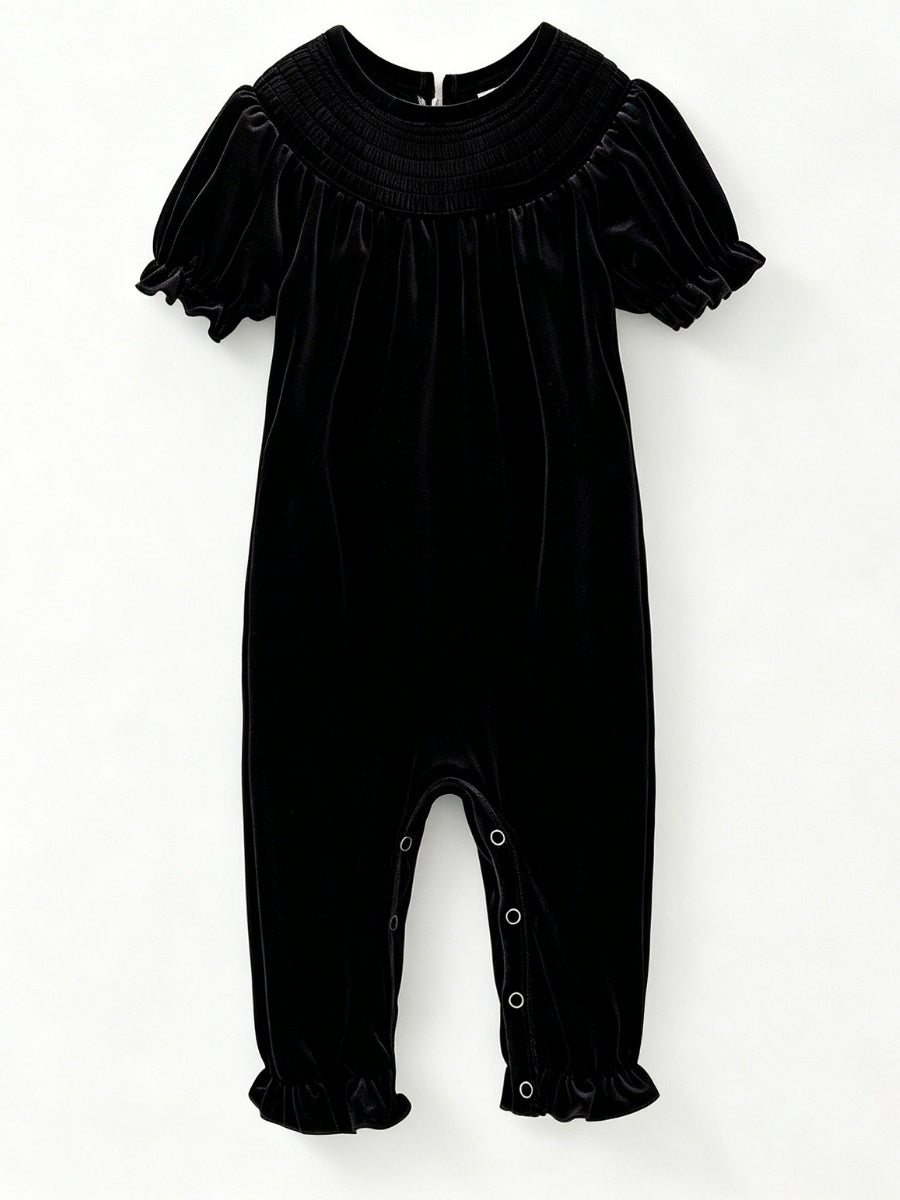 Black velvet baby girl romper with smocked yoke and short puff sleeves — The Hair Bow Company holiday outfit