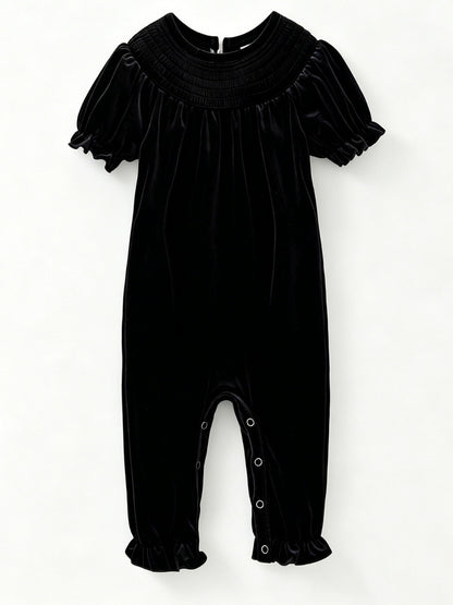 Black velvet baby girl romper with smocked yoke and short puff sleeves — The Hair Bow Company holiday outfit
