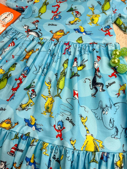 Fabric with Dr. Seuss character pattern on a blue background