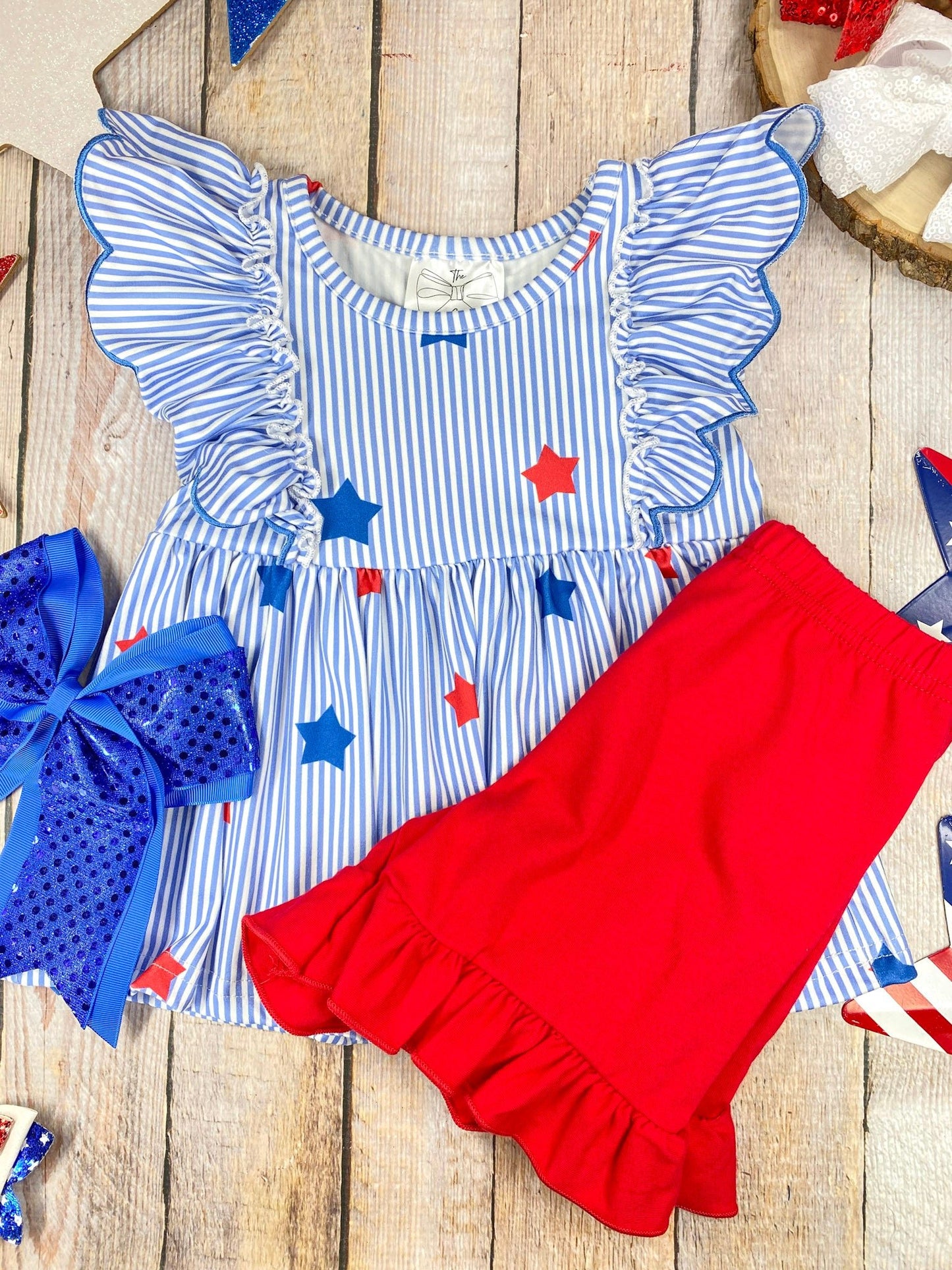  Stars & Stripes Ruffle Shorts Set on a wooden background