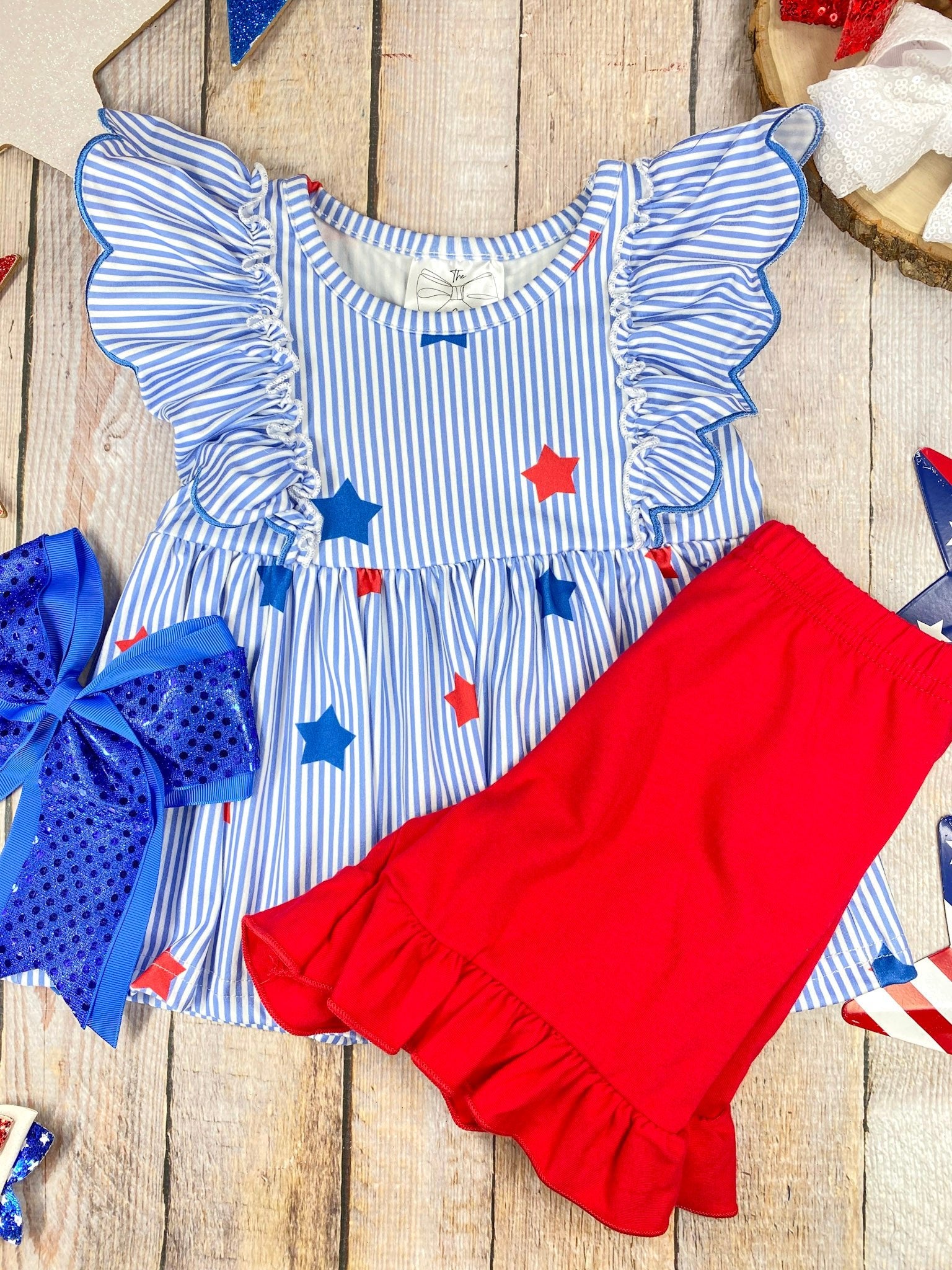  Stars & Stripes Ruffle Shorts Set on a wooden background