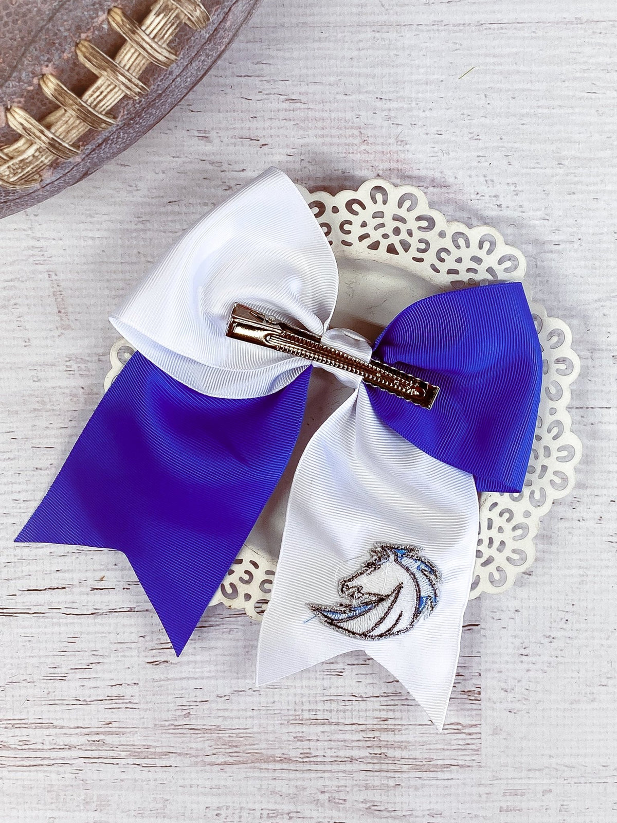 Back of blue and white Chargers cheer bow