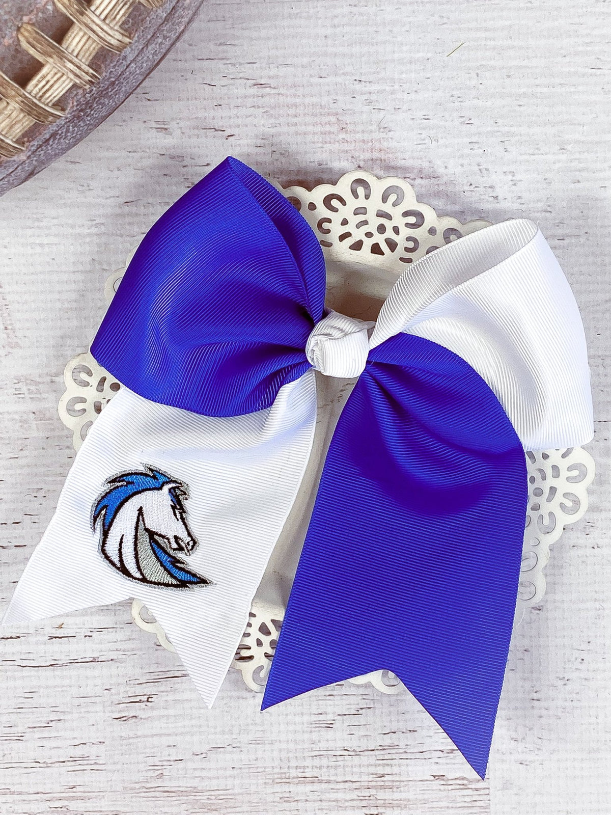 Blue and white Chargers cheer bow