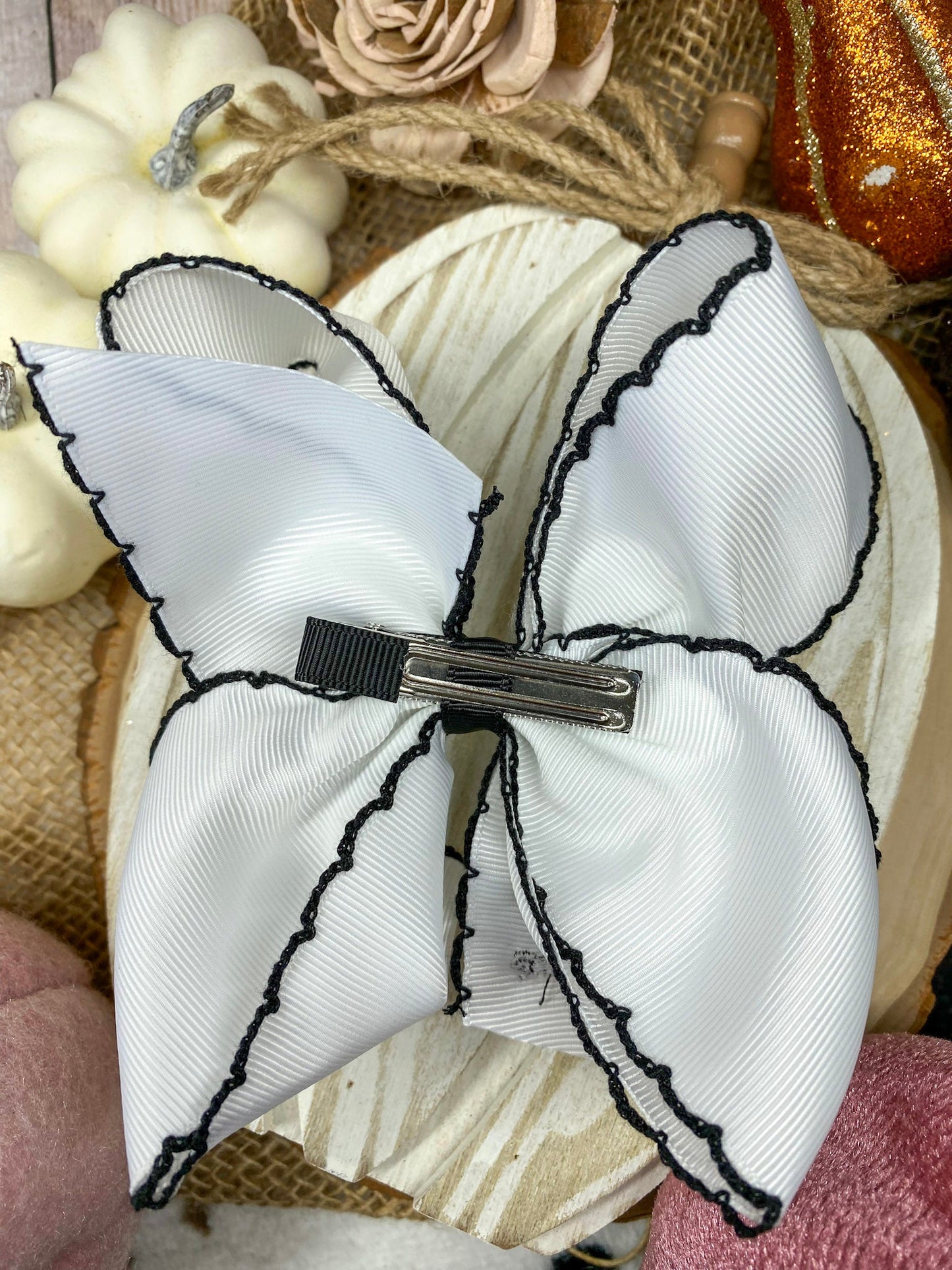 Black and White Boo Halloween Hair Bow on a wooden background
