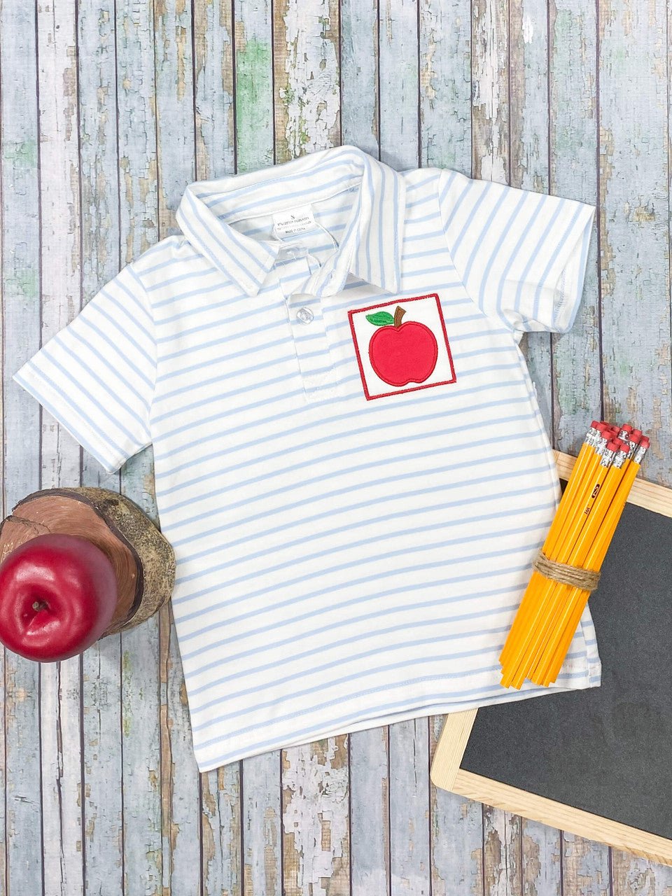 Boys collared shirt with blue stripes and an apple