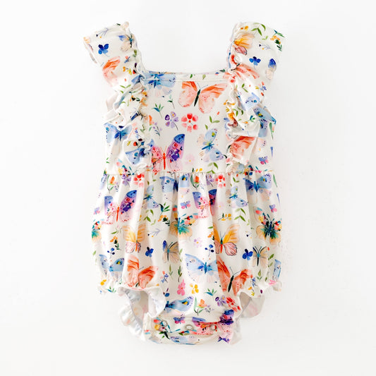 Floral baby romper with butterfly design on a white background