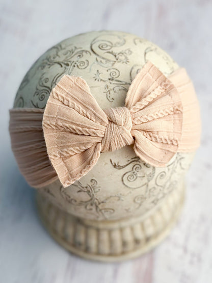 Blush cable knit bow headband