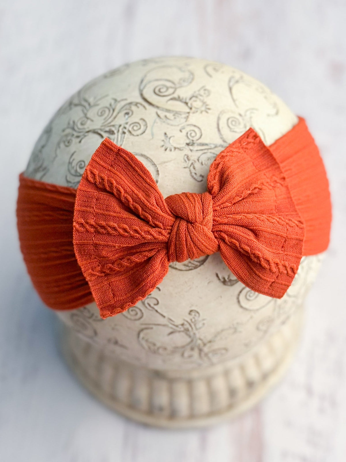Burnt orange cable knit bow headband