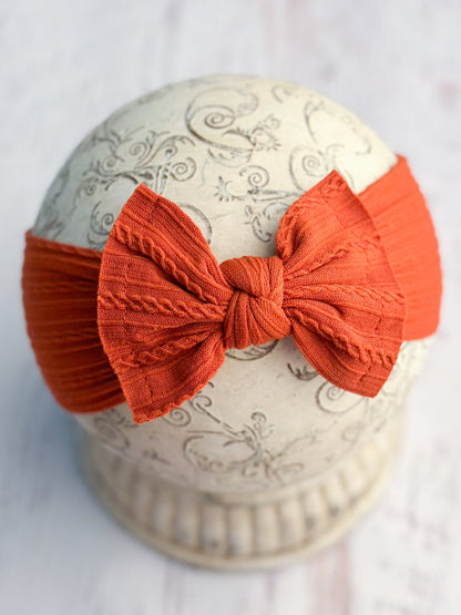 Burnt orange cable knit bow headband