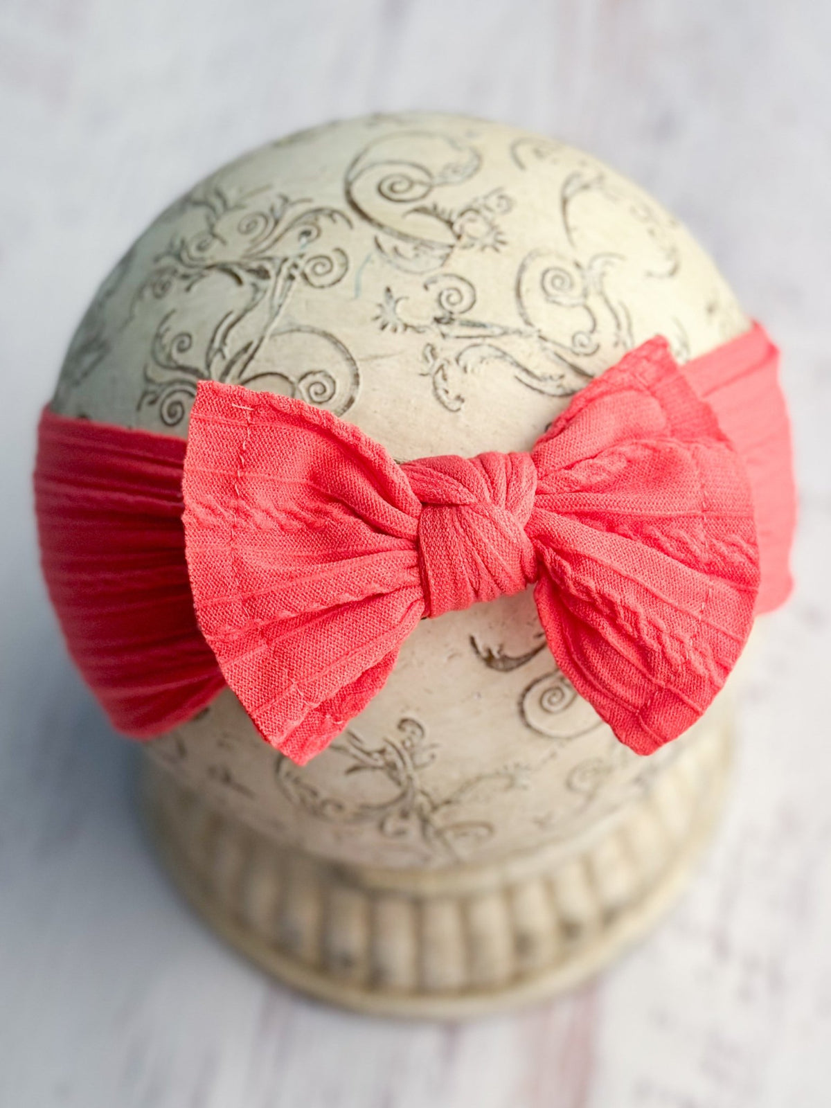 Coral cable knit bow headband