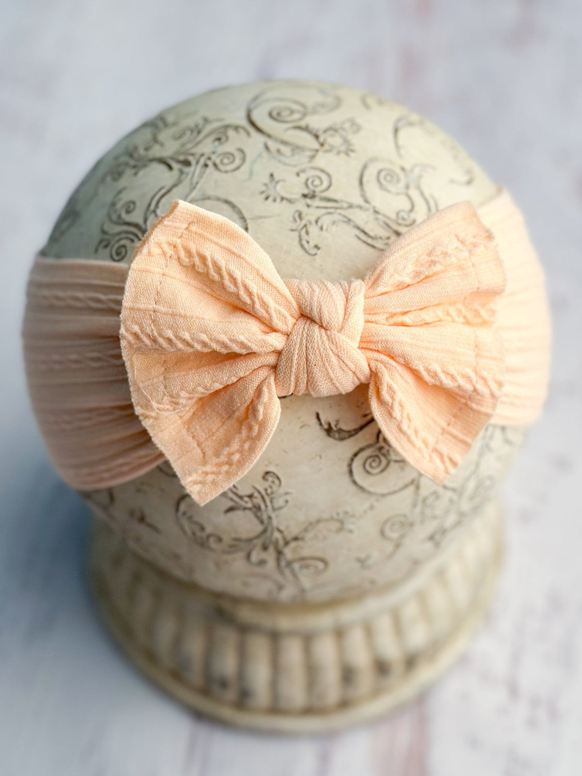 Light orange cable knit bow headband