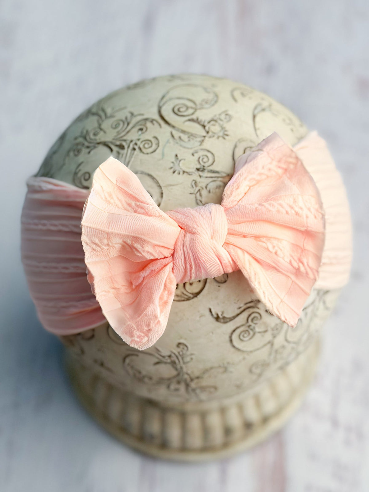 Peach cable knit bow headband