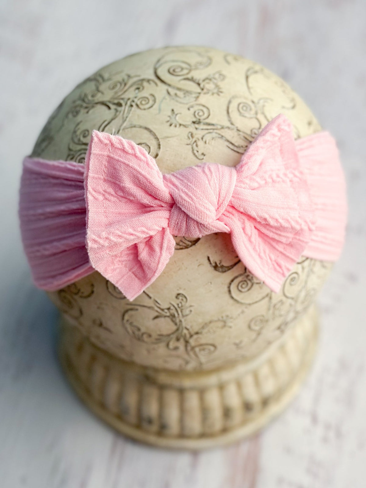 Pink cable knit bow headband