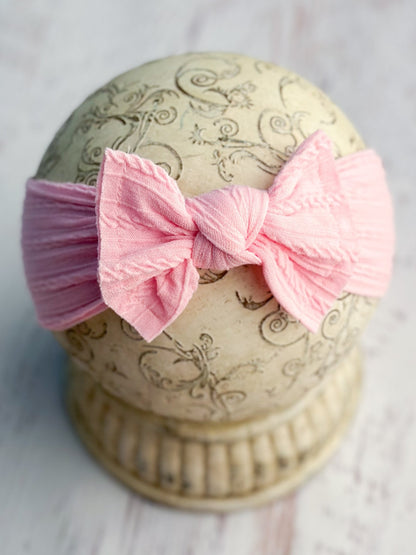 Pink cable knit bow headband