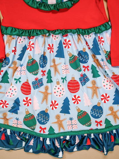 Christmas-themed skirt with gingerbread men, ornaments, and trees on a blue background.
