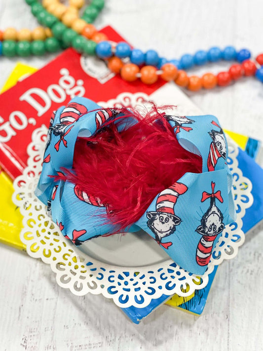 Turquoise Cat in the Hat print hair bow with red feather puff center