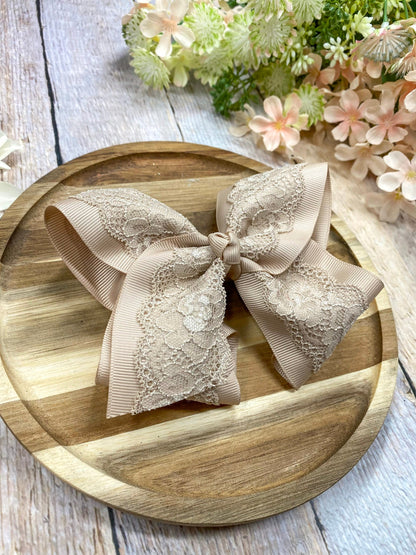 oatmeal  lace bow on wood