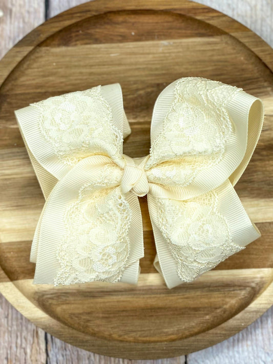 Ivory Chantilly Lace Classic Hair Bow on wood