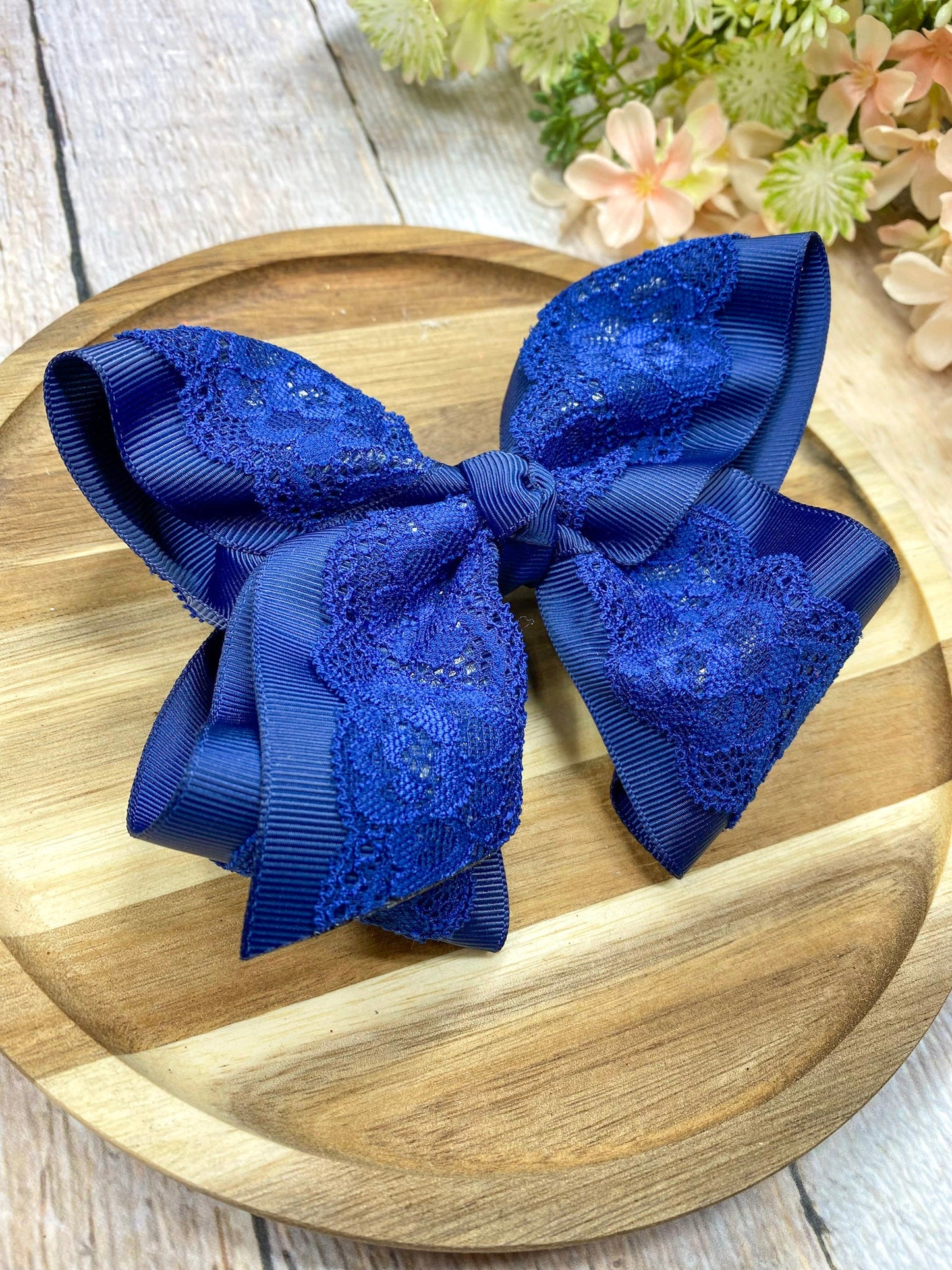 navy  lace bow on wood