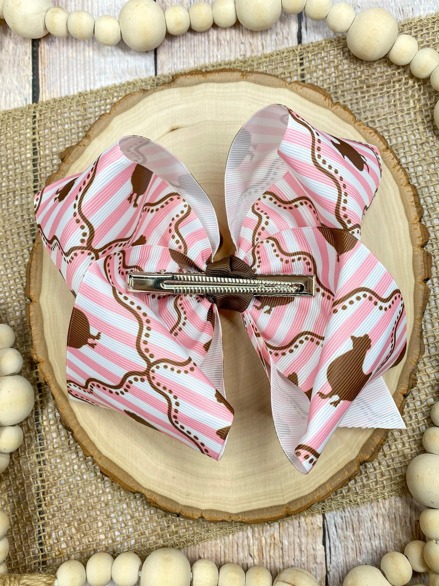 Chicken Coup Print Classic Hair Bow on a wooden surface