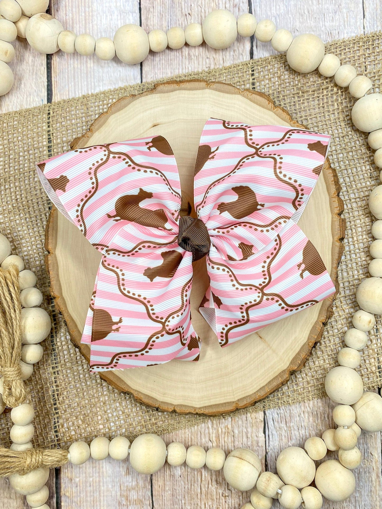 Chicken Coup Print Classic Hair Bow on a wooden surface