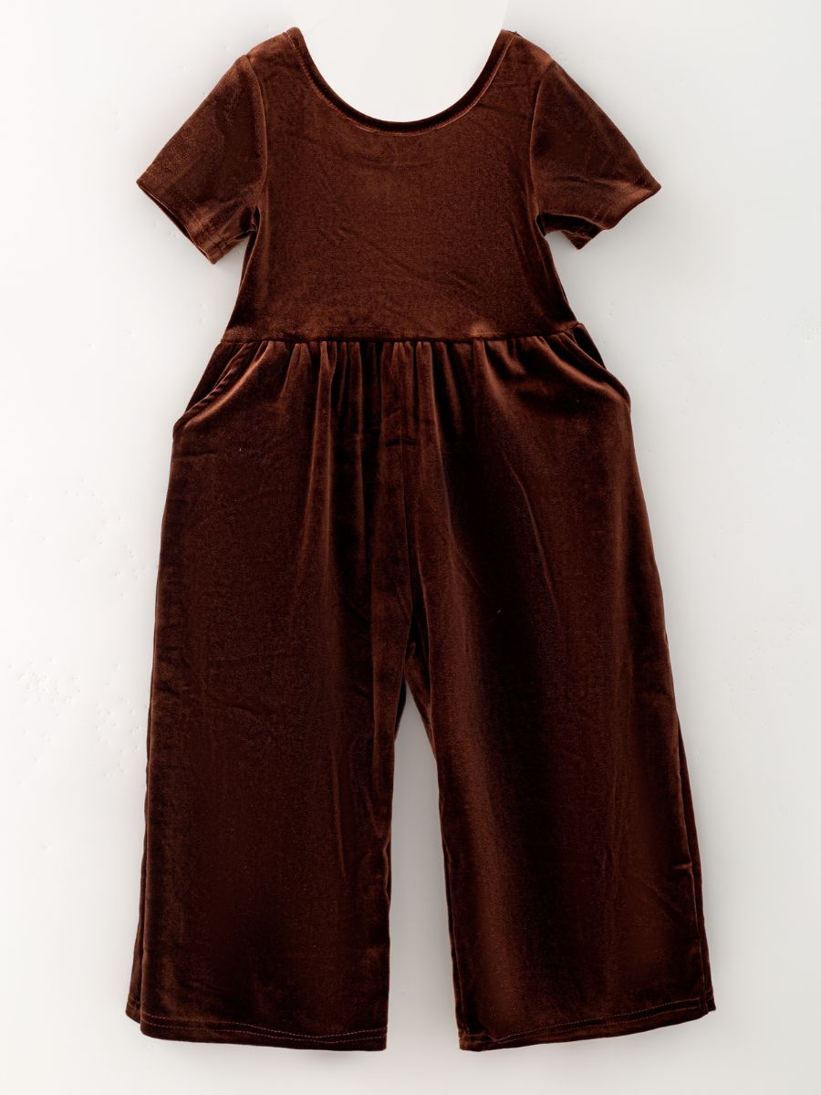 Chocolate brown girls’ velvet wide-leg jumpsuit with short sleeves and side pockets.
