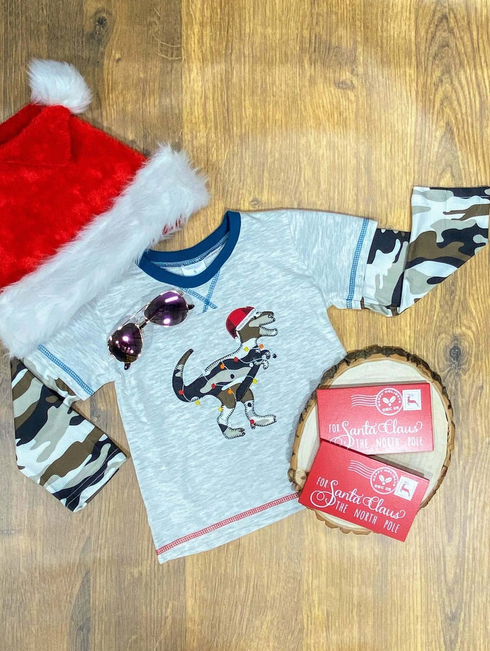 Boys Christmas tee with a Santa hat dinosaur and camo sleeves