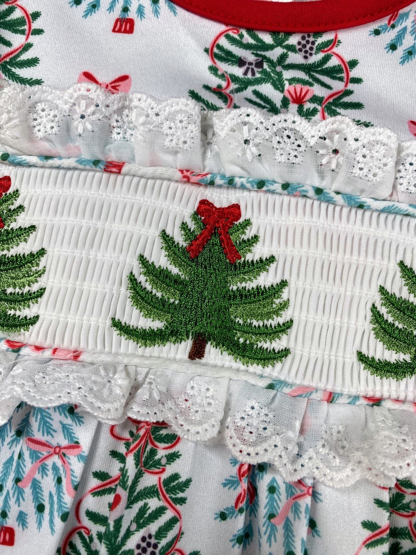 Baby Christmas outfit romper with smocked detail and red bows