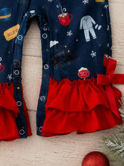 Close-up of red ruffle leg cuffs and Christmas train print on girls holiday infant romper.