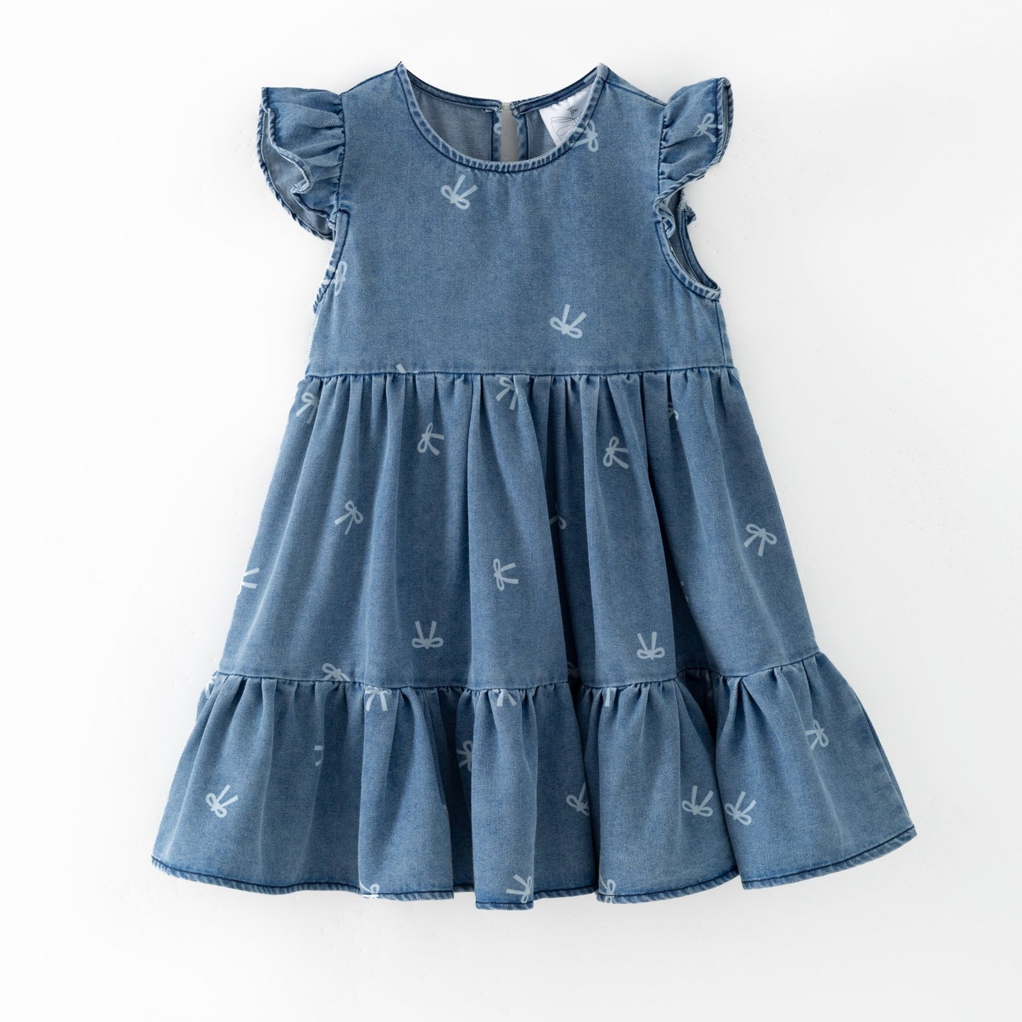 Blue denim bow print dress with ruffled sleeves and bottom on a white background