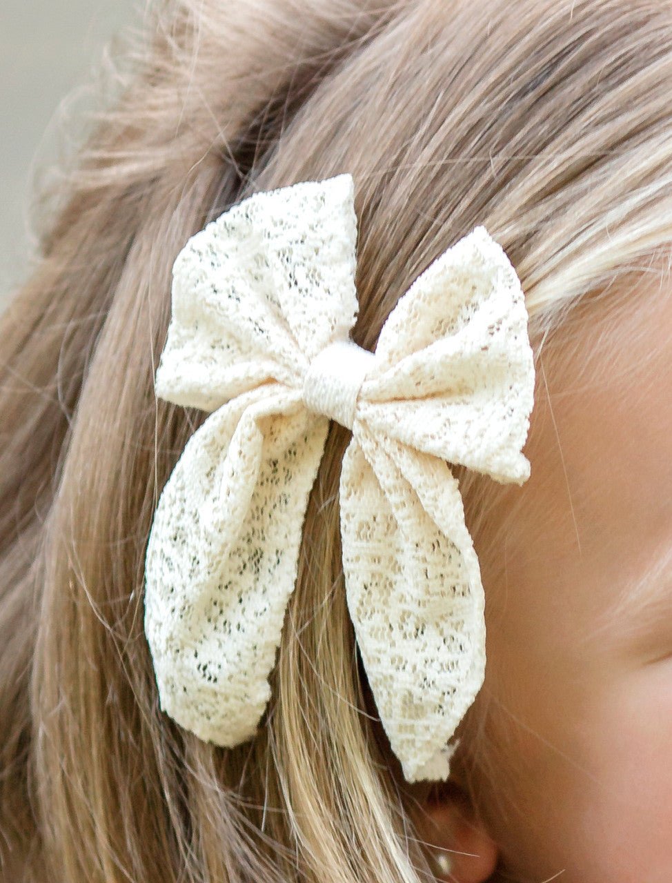 Close-up of classic eyelet lace hair bow