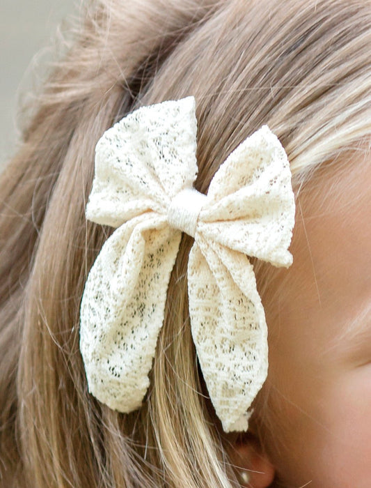Close-up of classic eyelet lace hair bow - Alternative view