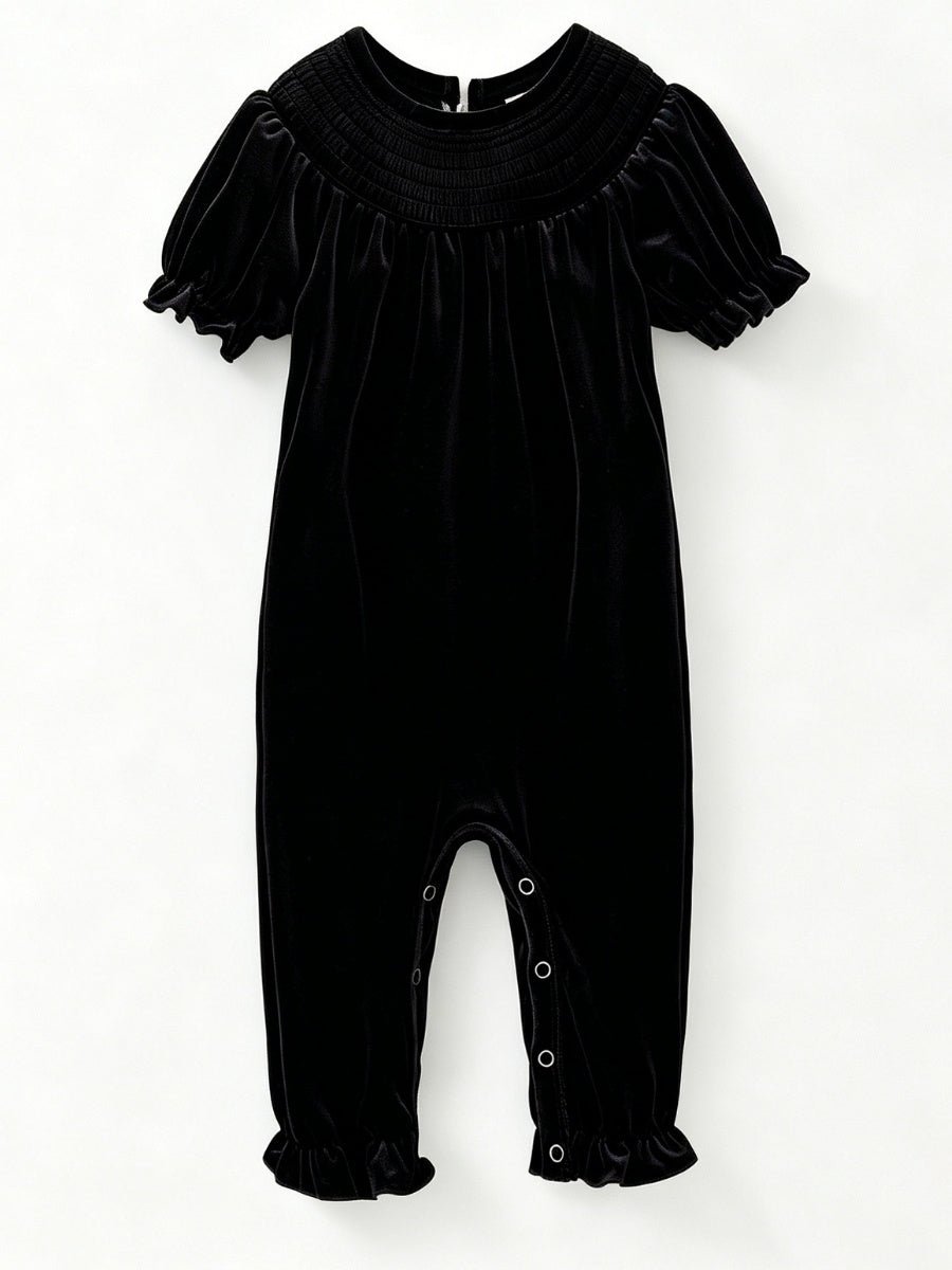 Black velvet baby girl romper with smocked yoke and short puff sleeves — The Hair Bow Company holiday outfit