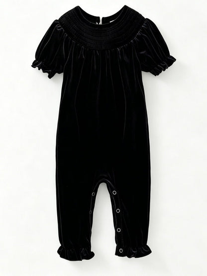 Black velvet baby girl romper with smocked yoke and short puff sleeves — The Hair Bow Company holiday outfit