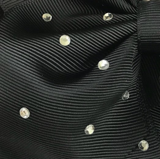 Close-up of black fabric with silver studs