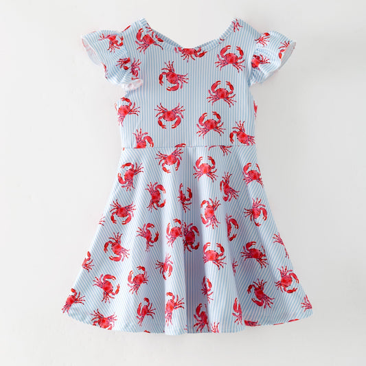 Dress with red crab pattern on a light blue background