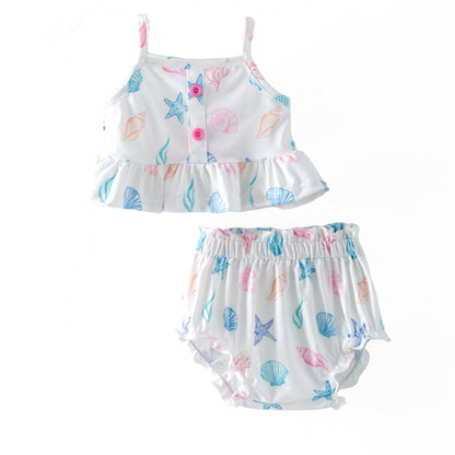 Children's two-piece romper with shell and starfish pattern on a white background