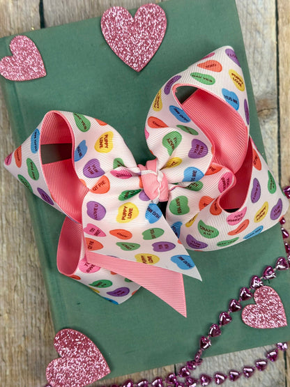 conversation heart bow on green book