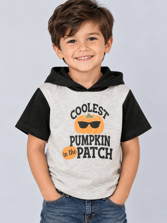 Kid wearing the Coolest Pumpkin in the Patch hoodie with jeans