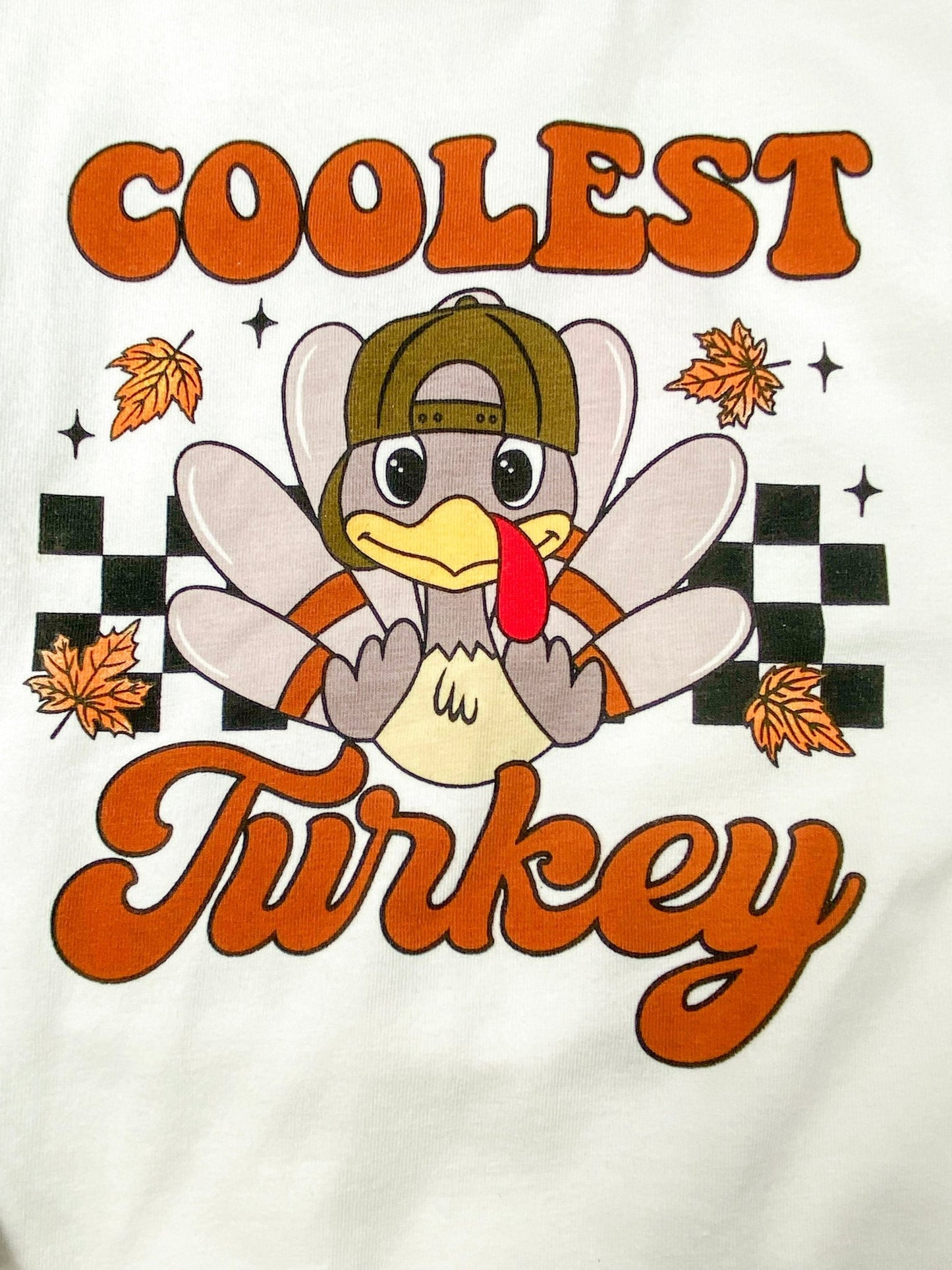 close up photo of the "coolest turkey" print on front of shirt