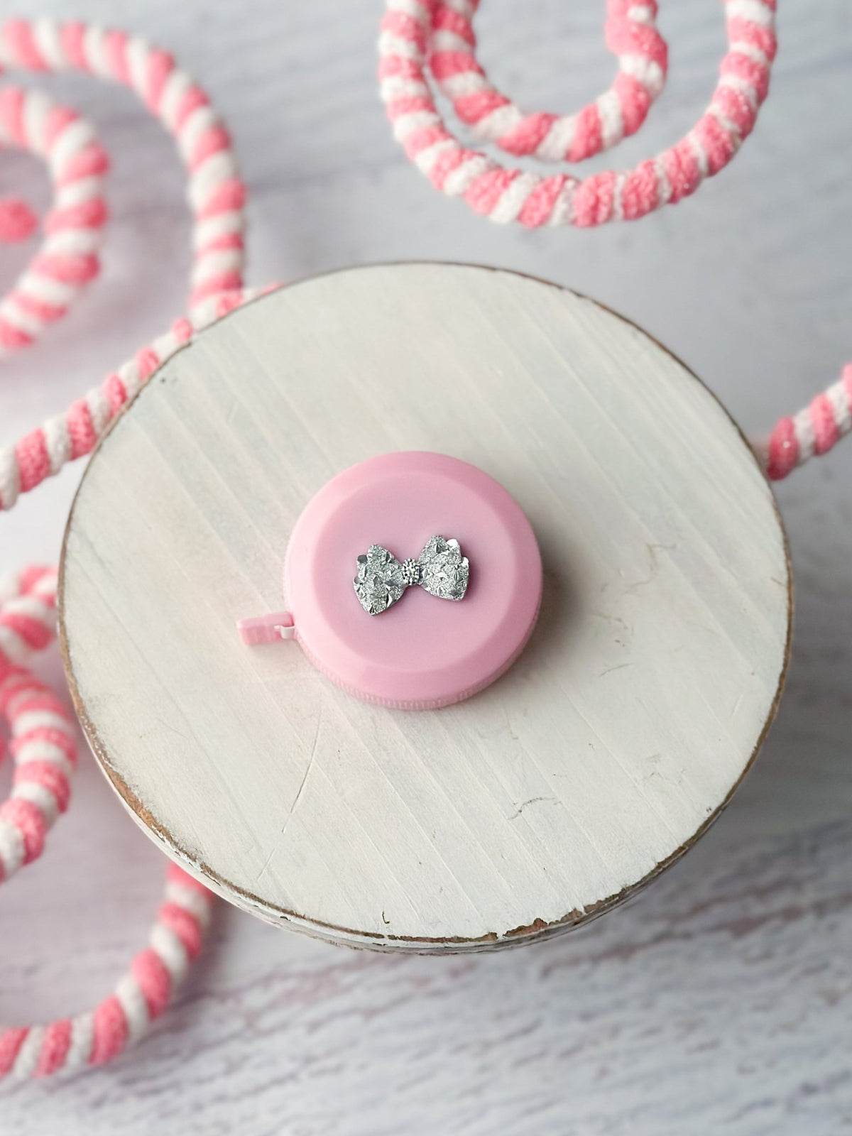 Bling measuring tape with a coquette bow