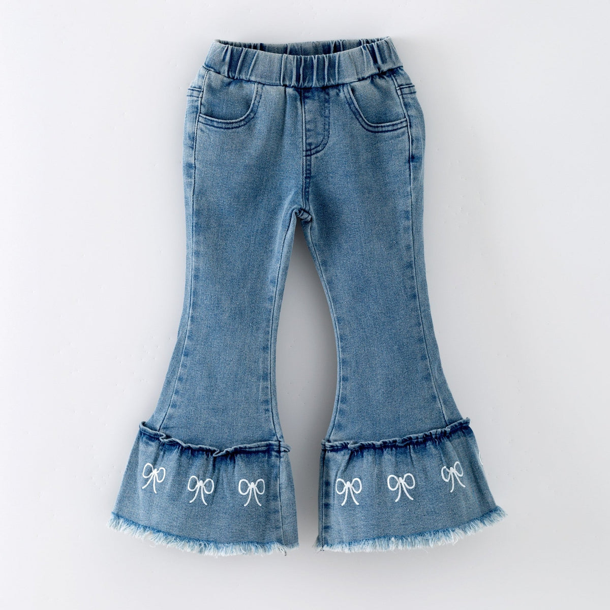 Ruffle hem jeans with little bows on a white background