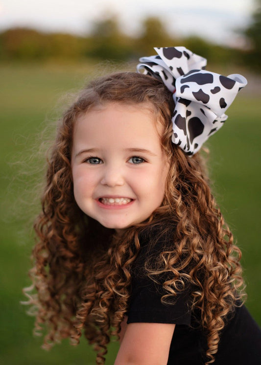 Cow print Texas size knot hair bow with red center on large alligator clip - Alternative view