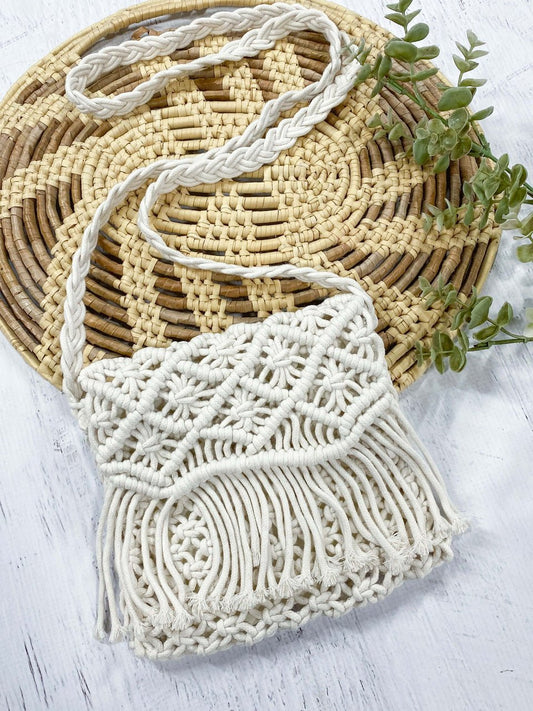 Cream macrame fringe purse with shoulder carrying strap